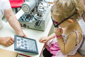 Little girl getting her eyes tested